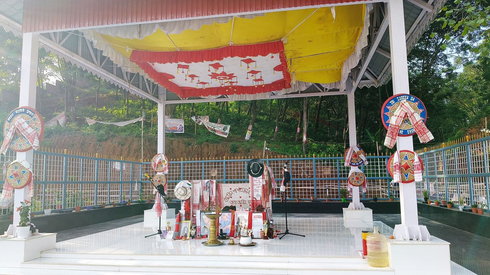 The white memorial at Zubeen Kshetra decorated with gamosas